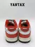 Zapatillas Nike Dunk Low Chicago Split vistas desde atrás con detalles en rojo, blanco y negro