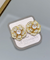 Brinco flor zircônia dourado