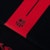 Close-up of the Barcelona 2024/2025 Away Jersey featuring the club's logo and red accents on a black fabric.