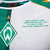 Camiseta verde y blanca del Werder Bremen, con detalles sobre el jugador Diego Ribas, incluyendo estadísticas y logros.