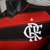 Camisa do Flamengo 2025, modelo home, nas cores vermelha e preta, destacando o logotipo do clube.