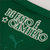 Close-up of the Palmeiras Home 2025 Jersey showing the text "DE FATTO É CAMPEÃO" in white on a green fabric.