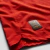 Close-up of the Portugal Home 2025/2026 Puma red football jersey showing the authentic label.