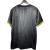 Back view of the México Home 2025 Jersey by Adidas in black and gold, featuring intricate patterns and yellow accents on the sleeves.