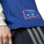 Close-up view of the Arsenal Terrace Icons 2025 jersey, showcasing the blue fabric and Adidas branding.