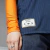 Close-up of the Juventus 2025 jersey featuring an orange sleeve and a label with the Juventus logo.