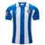 Frente de la camiseta del Espanyol Local 24/25. Detalles en azul, escudo destacado. Estilo elegante y deportivo.