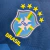 Emblema da Camisa Seleção Brasileira II 20/21 Torcedor Nike Feminina, mostrando o escudo da CBF com estrelas e a palavra "BRASIL".