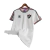 White Fluminense retro soccer jersey 2014-2015 with red and green details hanging on wooden hanger