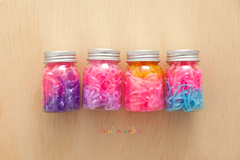 Elásticos: Pote de liguinhas mais grossas - rosa claro, rosa pink, azul - comprar online