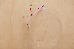 Tiara em acrílico: Laço lateral G transparente glitter na internet