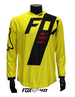 Jersey FOX 180 de motocross para hombre en color amarillo con detalles negros y rojos.

