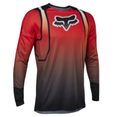 Jersey de motocross Fox Racing en rojo con detalles en naranja y mangas largas, ideal para alto rendimiento.

