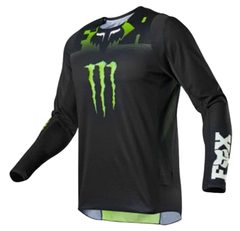 Jersey Fox 360 Monster Black para motocross y BMX. Diseño negro con gráficos Monster Energy, fabricado con materiales transpirables y de alto rendimiento.