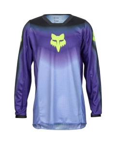 Jersey de motocross Fox en tonos morado y azul con logo amarillo, transpirable y de alto rendimiento.