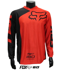 Jersey FOX 180 rojo y negro, diseño moderno y aerodinámico para motocross y BMX.