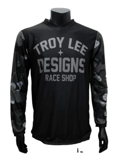 Jersey Troy Lee Designs 030 en color negro con diseño Race Shop, ideal para motocross y BMX, fabricado con materiales transpirables y resistentes