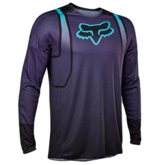 Jersey de motocross Fox Racing en morado con detalles en azul y mangas largas, ideal para alto rendimiento.

