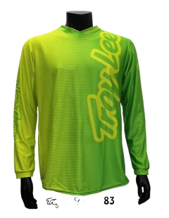 Jerseys Troy Lee Designs en colores verde fluo y negro, ideales para motocross y enduro, con diseño transpirable y resistente