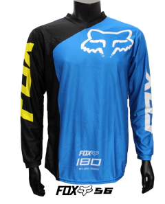 Jersey FOX 180 en color azul con detalles negros y amarillos, ideal para motocross y BMX, exhibido en maniquí negro.