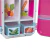 Interior de una heladera de juguete Divertoys con cajones organizadores transparentes y dibujos de verduras y frutas, ideal para niños.