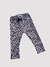 Calza térmica de print leopardo en tonos marrones, con cintura elástica y lazo decorativo.