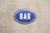 PLACA OVAL BAR