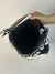 Bolsa Lateral Poá Preta e Branca na internet