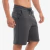 Bermuda moletom masculina na cor chumbo, com bolsos laterais e ajuste na cintura, destacando o conforto e a praticidade.