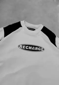 REMERA BOXY FIT RECHARGE BLANCA - TEXAS STORE