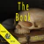Imagem do audiolivro "The Book" com um crânio sobre um livro, destacando o título em amarelo.