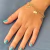 PULSEIRA 3 CORRENTES COM PINGENTE FE FOLHEADA EM OURO 18K na internet