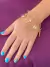 PULSEIRA DUPLA COM PINGENTES CORACAO E CHAVE FOLHEADO EM OURO 18K na internet