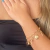PULSEIRA DUPLA COM PINGENTES CORACAO E CHAVE FOLHEADO EM OURO 18K - comprar online