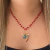 COLAR VERMELHO E PINGENTES DA SORTE FOLHEADO EM OURO 18K - comprar online