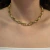 COLAR DE ELOS OVAIS PEQUENOS TRANSPASSADOS DOURADO - comprar online