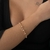 PULSEIRA DUPLA BOLAS FOLHEADO EM OURO 18K
