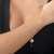 PULSEIRA DUPLA COM PINGENTES DA SORTE FOLHEADO EM R - comprar online