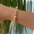 PULSEIRA BOLA LISA E FOSCA FOLHEADA EM OURO 18K