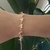 PULSEIRA COM PINGENTE I LOVE YOU E CORA na internet