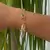 PULSEIRA DE ELOS COM 1 PINGENTE DE BUZIO FOLHEADO EM OURO 18K - comprar online