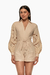 Romper de mangas caladas color beige, con un diseño elegante y ceñido a la cintura. Mod. Katerin sku. 34929