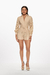 Romper de mangas caladas color beige, con un diseño elegante y ceñido a la cintura. Mod. Katerin sku. 34929