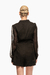Romper negro con cinturón de hebilla abstracta, con diseño de mangas transparentes y corte elegante. Mod. Sira Sku. 33955