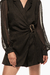 Romper negro con cinturón de hebilla abstracta, con diseño de mangas transparentes y corte elegante. Mod. Sira Sku. 33955