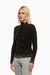 Suéter negro de textura suave de cuello alto y adornos de joyas brillantes. Mod Vera Sku. 34271