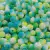 Pérolas craqueladas multicores de 10mm em uma variedade de tons de verde e azul, perfeitas para artesanato.