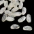 Beads de resina mesclada em formato oval, medindo 31x11mm