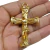 Pingente de cruz dourado com a figura de Cristo, medindo 62x39mm