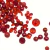 Mistura de pedrarias natalinas em tons de vermelho, ideal para bijuterias e decoração de Natal.